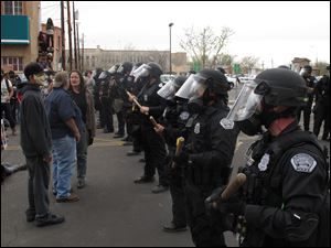 Albuquerque police face off with protesters Sunday in downtown Albuquerque, N.M. during a protest against recent police shootings. 