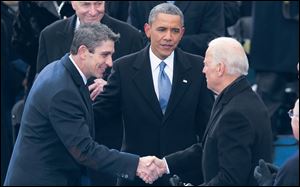 Richard Blanco meets with President Obama and Vice President Biden at the inauguration Jan. 13, 2013 in Washington.  