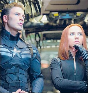Chris Evans and Scarlett Johansson reprise their roles as Captain America and Black Widow in ‘Captain America: The Winter Soldier.’  