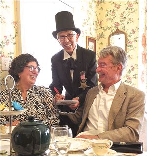 Peggy and Steve Pollick, retired Blade outdoors editor, seated, get ‘prescriptions’ filled by Mary Edwards Walker, portrayed by Sheila Otto. 