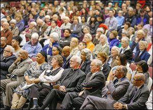 A diverse crowd attends the forum, including the Rev. Otis Gordon, far right, and the Rev. Robert Culp, second from right. They are co-chairmen of the Toledo Community Coalition, one of the sponsors of the event. 