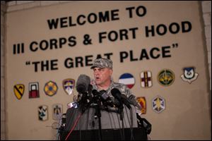 Lt. Gen. Mark Milley, commanding general of III Corps and Fort Hood, speaks with the media outside of an entrance to the Fort Hood military base following a shooting that occurred inside, Wednesday in Fort Hood, Texas.