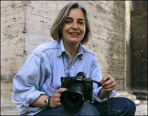 Associated Press photographer Anja Niedringhaus poses for a photograph in Rome in 2005. Niedringhaus, 48, was killed and an AP reporter was wounded on today when an Afghan policeman opened fire while they were sitting in their car in eastern Afghanistan. 