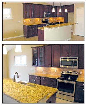 The colorful backsplash and granite counter tops are design highlights.