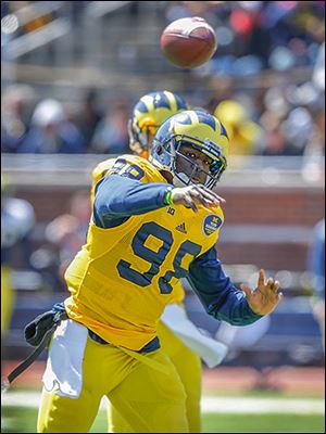 University of Michigan's Devin Gardner (98) throws during the annual spring game at Michigan Stadium, Saturday.