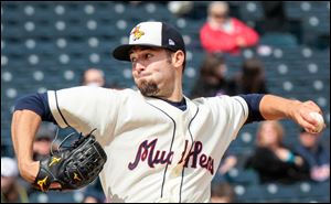 The Hens’ Robbie Ray winds up in the top of the fifth inning on Sunday. Brought in after the trade of the Tigers’ Doug Fister, Ray struck out three and walked one over five innings for Toledo.