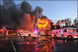 Firefighters respond to a multiple alarm fire at the popular Lakeview Pavilion in Foxboro, Mass. A wedding was taking place at the time of the fire.