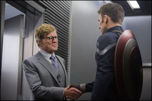 Robert Redford, left, and Chris Evans in a scene from 