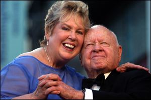 Jan, left, and Mickey Rooney pose for photographs in April, 2004.