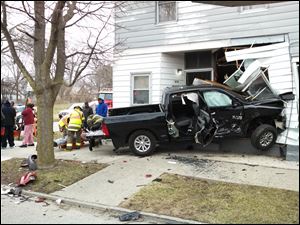 A pickup truck crashed into a house on Hamilton Street.