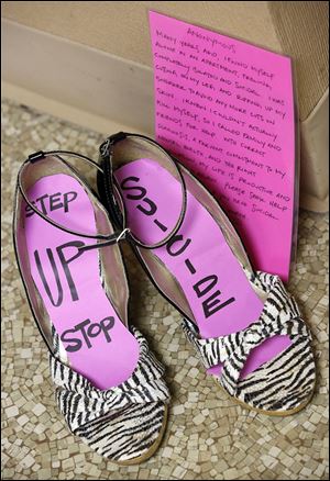 A path of shoes representing victims of suicide at Mercy College in Toledo.