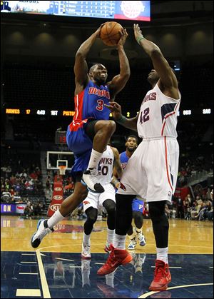 Detroit Pistons guard Rodney Stuckey (3) goes up for the shot against Atlanta Hawks forward Elton Brand (42) in the first period.