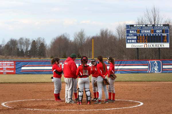 Softball09p-Central-Catholic-brings-it-in-to-regroup-d