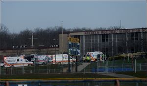 Emergency responders gather at the high school on the campus of the Franklin Regional School District, where several people were stabbed early today.