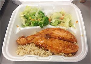 Salmon teriyaki with brown rice and mixed vegetables.