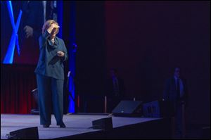 Hillary Rodham Clinton looks into the audience after an object was thrown on stage during her address to members of the Institute of Scrap Recycling Industries during their annual convention today at the Mandalay Bay Convention Center in Las Vegas.