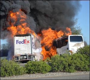 Massive flames are seen devouring both vehicles just after the crash, and clouds of smoke billowed into the sky Thursday until firefighters had quenched the fire, leaving behind scorched black hulks of metal. The FedEx tractor-trailer crossed a grassy freeway median in Northern California and slammed into the bus carrying high school students on a visit to a college. At least nine were killed in the fiery crash, authorities said. 