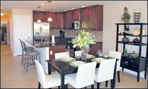 This lovely island kitchen is open to the dining area. Both are open to the great room. 