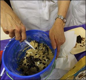 A woman mixes batter during the baking class.