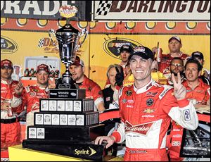 Kevin Harvick celebrates in Victory Lane after winning the Sprint Cup series race at Darlington Raceway on Saturday night. It was his second victory of the season.