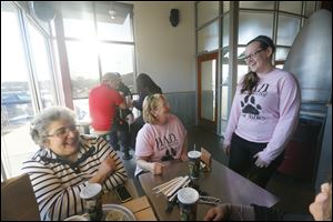 Ashley Kinstler, right, a Type I diabetic, speaks with her aunt Ginny Kinstler, center, and Cathy Hammoud at a fund-raiser. She needs $15,000 for a service dog to help monitor her blood sugar.