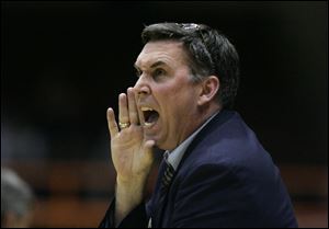 Liberty-Benton head coach Steve Williman shouts instructions to his team during a game in 2007.