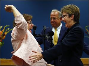 Judge Black's ruling declares Ohio must recognize same-sex marriages performed legally in other states, such as the marriage of Beth Asaro, left, and Joanne Schailey, right who were wed in Lambertville, N.J. in October, 2013.