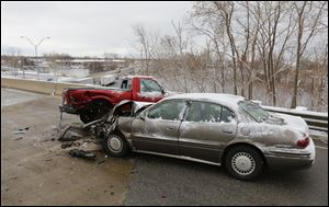 A pair of vehicles collided on Benore Road, while, in the background, traffic moves slowly on southbound I-75 today.