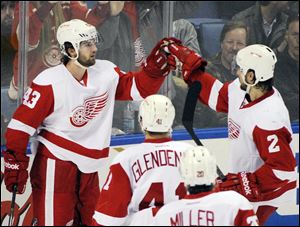 Detroit Red Wings' Darren Helm (43) celebrates his goal with Brendan Smith (2) along with Luke Glendening (41) and Drew Miller (20).
