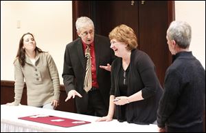 From left, Kerri Mikonowicz of Rossford, magician Martin Jarret, Heidi Williams of Fayetteville, Ga., and Dennis Burzynski of Toledo get a close-up view of a card trick.