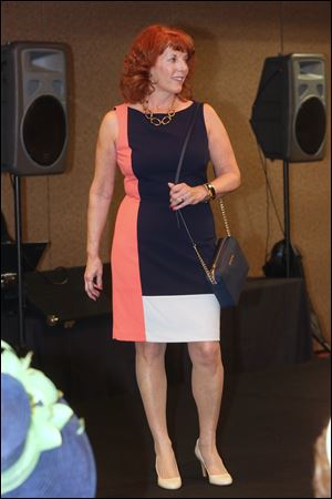Susan Noss, of Whitehouse, hits the runway at the Scintilla 2014 luncheon at the Premier in South Toledo.