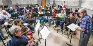 Fred Dais directs the Owens Community College Band for its upcoming spring concert, which will honor World War II veterans and observe the 70th anniversary of the D-Day invasion with a medley of songs.