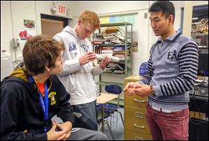 Jake Sarmento, left, Lucas Sturt, and Yuhang Zou talk about their rocket and the invitation to compete in the Team America Rocketry Challenge in Washington on May 10.