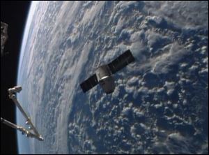 An image from NASA-TV shows the SpaceX Dragon resupply capsule approaching the International Space Station today.