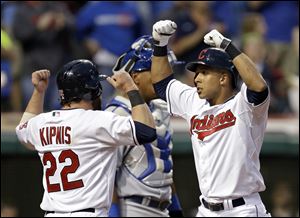 Cleveland Indians' Michael Brantley, right, celebrates his two-run home run against the Kansas City Royals with Jason Kipnis (22) in the fourth inning.