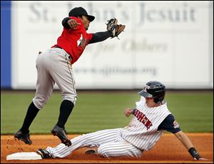 The Mud Hens’ Hernan Perez steals second base against Indianapolis as shortstop Michael Martinez fails to make the play Tuesday night at Fifth Third Field. Perez had two hits and scores a run.
