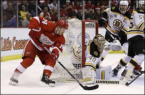Bruins goalie Tuukka Rask stops a goal attempt by Red Wings center Gustav Nyquist.