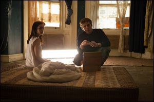 Olivia Cooke, left, and Sam Claflin in a scene from 
