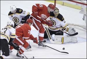 Bruins goalie Tuukka Rask prepares to stop a shot from the Wings’ Tomas Tatar during the second period. Rask had 32 saves.