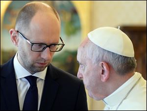 Pope Francis and Ukrainian Prime Minister Arseny Yatsenyuk look at each other on the occasion of their private audience today at the Vatican.