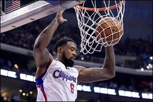 Los Angeles Clippers center DeAndre Jordan dunks against the Golden State Warriors during the first half. Jordan was the Clippers leading scorer, rebounder. 
