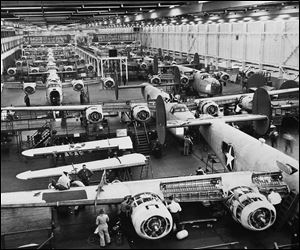 Workers assemble B-24 Liberator bombers at Ford's Willow Run plant in Ypsilanti Township, Mich. in March, 1943.