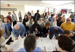 Job seekers line up for a job fair at Columbia-Greene Community College in Hudson, N.Y.