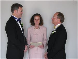 Mark Andrew, left, and Bishop V. Gene Robinson are shown during their private civil union ceremony performed by Ronna Wise in Concord, N.H., in this 2008 file photo.