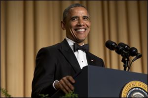 President Barack Obama smiles while making a joke during his speech at the White House Correspondents' Association Dinner Saturday at the Washington Hilton Hotel.