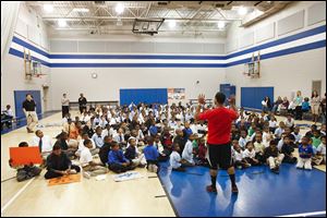 Students listen during a wellness assembly  at Martin Luther King, Jr., Academy, one of two same-gender public schools  in Toledo.