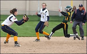 Notre Dame's Amanda Delmonte, left, prepares to tag out Clay's Courtney Quinlan in the top of the fifth inning.