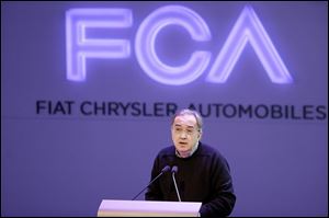 Chrysler Group LLC Chairman and CEO Sergio Marchionne speaks to investors Tuesday at the automaker’s world headquarters in Auburn Hills, Mich. about its plans as a combined entity.