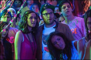 Rose Byrne and Seth Rogen in a scene from ‘Neighbors.’