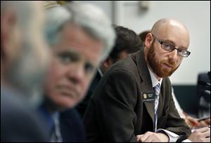 Rep. Jonathan Singer, (D., Longmont), listens to discussion on a bill he sponsored which would allow marijuana dispensaries to form financial co-operatives, at the Colorado Legislature, in Denver, Wednesday.